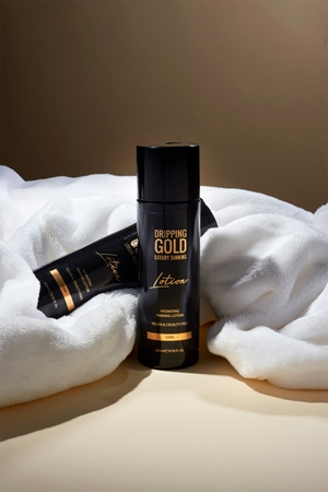 Dripping Gold Luxury Tanning Lotion kosteuttava itseruskettava maito voimakkaaseen rusketukseen