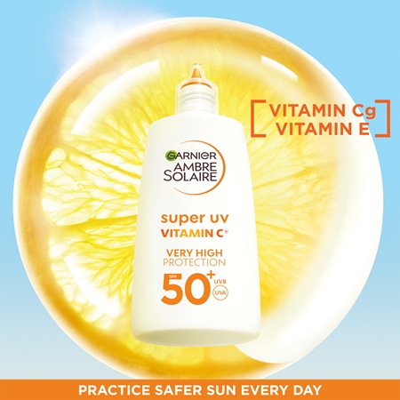 Garnier Ambre Solaire Super UV Vitamin C Let beskyttende væske til at behandle mørke pletter