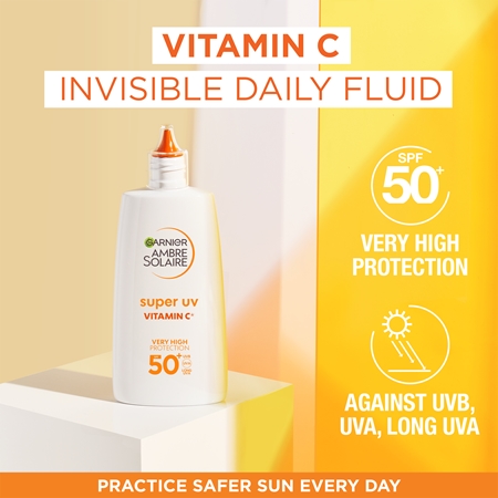Garnier Ambre Solaire Super UV fluido de proteção leve contra manchas escuras com vitamina C